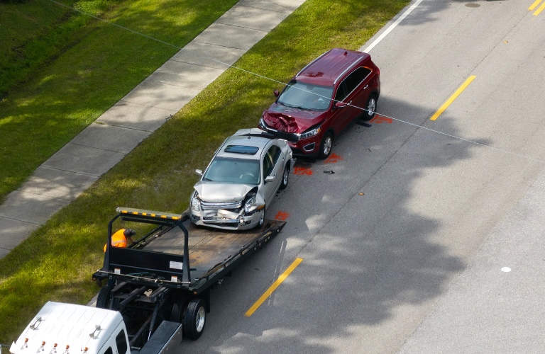 Tow truck loading crashed car
