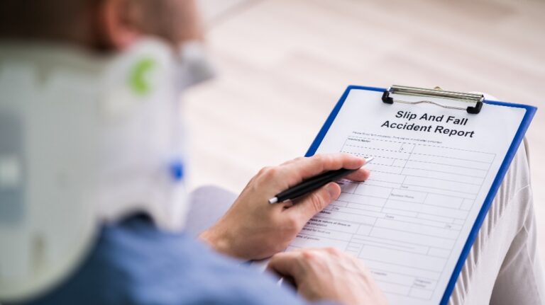 Injured man is filling slip and fall accident report