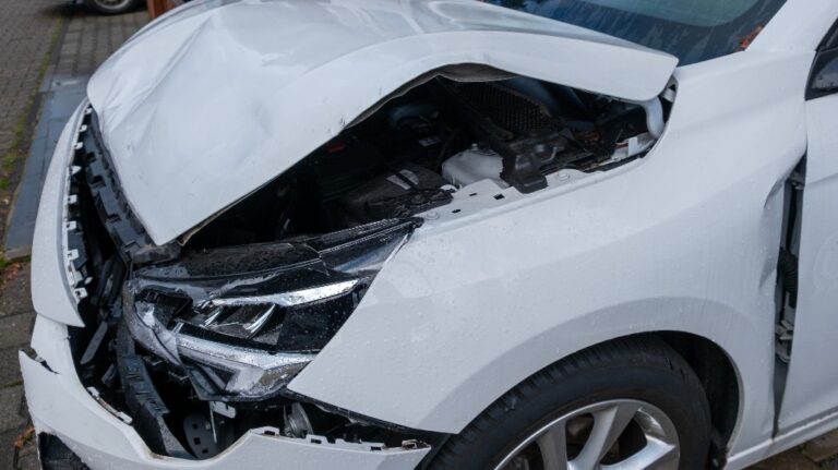 front of white crashed car