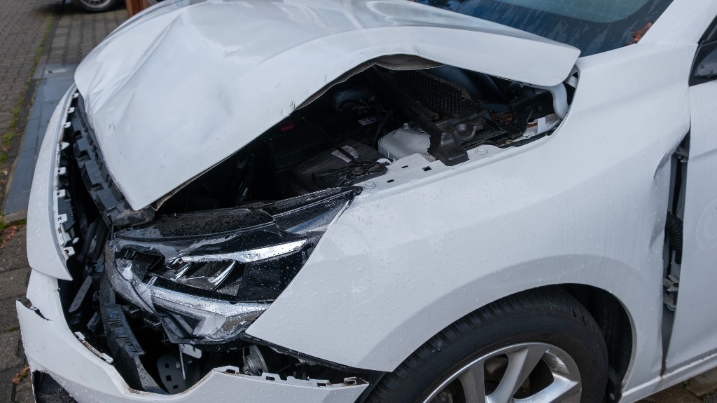 front of white crashed car