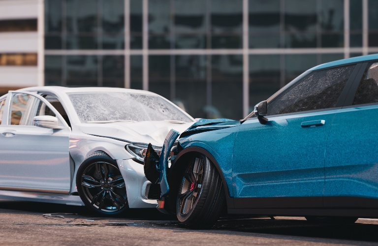white and blue cars crashed